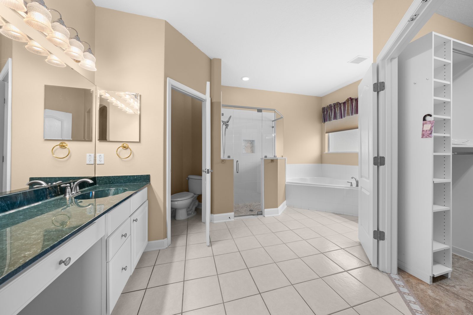 Primary bath with garden tub and walk-in closet